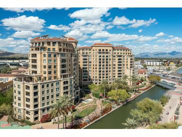 Stunning aerial view of waterfront property and community featuring palm trees and cityscape views at 7175 E Camelback Rd # 510, Scottsdale, AZ 85251