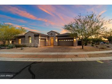 Inviting single-story home with a three-car garage, desert landscaping, and a paver driveway at 1713 W Calle Marita --, Phoenix, AZ 85085