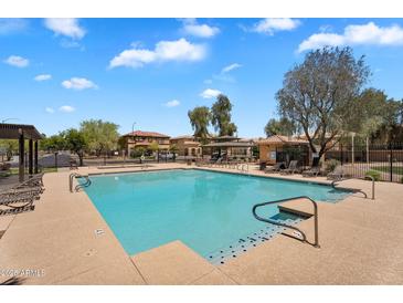 Sparkling community pool with lounge seating, perfect for relaxation and enjoyment at 6469 W Ruth Ave, Glendale, AZ 85302