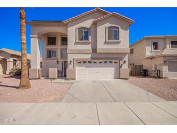 Charming two-story home with a two-car garage, a lovely facade, and a well-maintained desert landscape at 17258 W Meghan Dr, Goodyear, AZ 85338