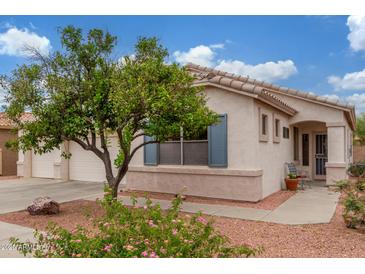 Charming single-Gathering home features a well-maintained yard with a spacious three-car garage at 18562 N Alamo Dr, Surprise, AZ 85374