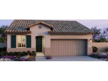 Charming single-story home with a spacious two-car garage, desert landscaping, and a tiled roof at 22360 W Monona Ln, Surprise, AZ 85387