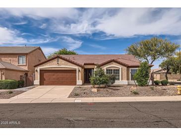 Charming single-story home featuring a two car garage, neutral paint, and a well-manicured front yard at 4346 E Prickly Pear Trl, Phoenix, AZ 85050