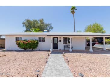 Charming single-story home with a walkway, desert landscaping, and a covered porch at 808 N 78Th St, Scottsdale, AZ 85257