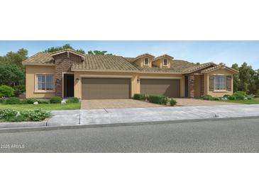 Charming two-story townhome with a brick facade and a two-car garage with a driveway at 17375 W Whispering Wind Rd, Surprise, AZ 85387