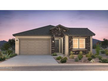 Charming single-story home boasting stone accents, a two-car garage, and well-maintained desert landscaping at 21254 E Cattle Dr, Queen Creek, AZ 85142