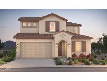 Charming two-story home with a two-car garage and desert landscaping at 21262 E Cattle Dr, Queen Creek, AZ 85142