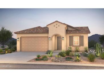 Charming single-story home featuring a tile roof and desert landscaping in the front yard at 21270 E Cattle Dr, Queen Creek, AZ 85142