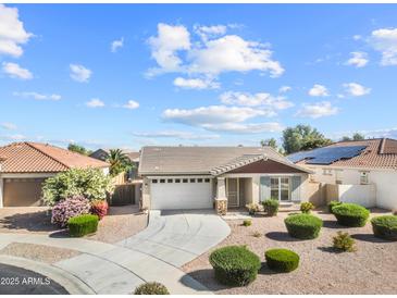 Charming single-story home with a well-manicured lawn and inviting curb appeal in a friendly neighborhood at 22274 E Cherrywood Ct, Queen Creek, AZ 85142