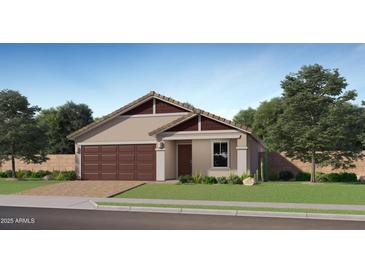 Charming single-Gathering home with a symmetrical design, paired garage and well-kept lawn at 23356 W Atlanta Ave, Buckeye, AZ 85326