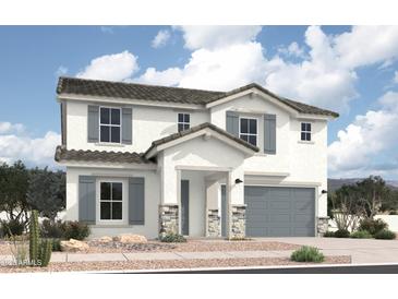 Two-story home with gray shutters and a gray garage door, and a stone pillar entry in a suburban community at 36875 W Santa Maria St St, Maricopa, AZ 85138