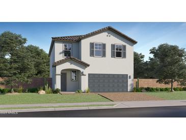 Charming two-story home with a two-car garage, a well-manicured lawn, and appealing architectural details at 4588 S 232Nd Dr, Buckeye, AZ 85326