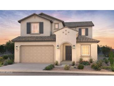 Inviting two-story home with neutral stucco, dark shutters, tile roof, two car garage, and desert landscaping at 21247 E Cattle Dr, Queen Creek, AZ 85142