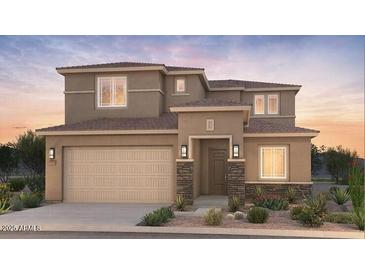 Attractive two-story home featuring a two-car garage and inviting front porch at 21255 E Cattle Dr, Queen Creek, AZ 85142