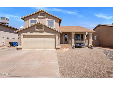 Charming two-story home featuring a well-manicured front yard and a two-car garage at 4118 W Fallen Leaf Ln, Glendale, AZ 85310