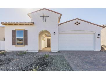 Charming single-Gathering home featuring a two-car garage and beautiful white stucco exterior at 16367 W Desert Mirage Dr, Surprise, AZ 85388