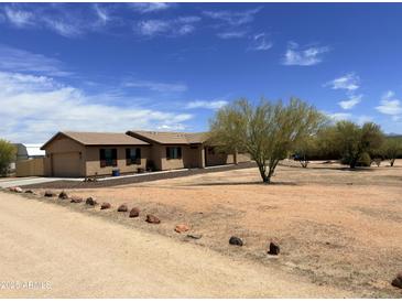 Charming single story home with desert landscaping in front yard at 30617 N 138Th Way, Scottsdale, AZ 85262