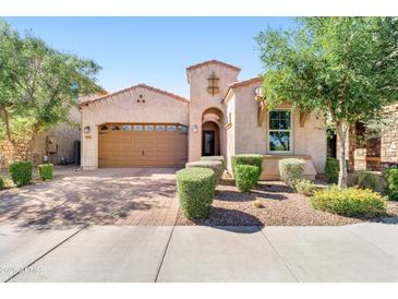Charming single-story home with a well-manicured front yard and a two-car garage at 4535 E Navigator Ln, Phoenix, AZ 85050