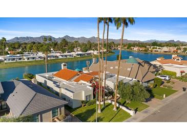 Stunning waterfront home boasts mountain views and a private backyard oasis at 8210 E Del Cadena Dr, Scottsdale, AZ 85258