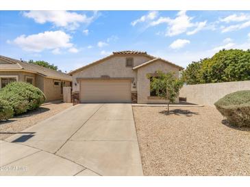 Charming single-story home featuring desert landscaping, a two-car garage, and a welcoming entrance at 812 S Fern Ct, Gilbert, AZ 85296