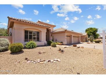 Charming single-story home boasting a desert-landscaped front yard and a spacious three-car garage at 1943 E Drake Dr, Tempe, AZ 85283