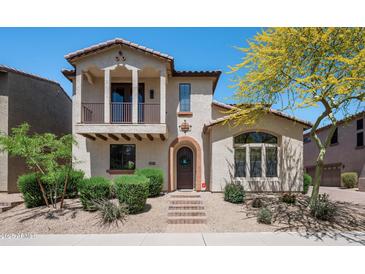 Charming two-story home with desert landscaping, balcony, and a welcoming front entrance at 2418 W Jake Hvn, Phoenix, AZ 85085