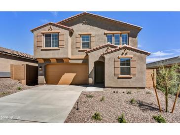 Two-story home with a two car garage, desert landscaping, and a concrete driveway at 13294 W Eagle Feather Rd, Peoria, AZ 85383