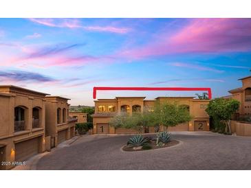 Close exterior view of homes showcases classic architecture with a backdrop of mountains and a colorful sky at 7199 E Ridgeview Pl # 221, Carefree, AZ 85377