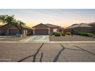 Charming single-story home featuring desert landscaping and a two-car garage at 34463 N Karan Swiss Cir, San Tan Valley, AZ 85143