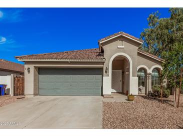 Charming single-story home showcasing a well-maintained yard, and a two-car garage at 4377 S Soboba St, Gilbert, AZ 85297