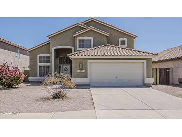 Charming two-story home with a tile roof and a two-car garage, set in a well-maintained neighborhood at 1079 E Jasper Dr, Gilbert, AZ 85296