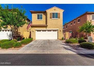 Inviting two-story home with a two car garage, manicured landscaping, and warm curb appeal at 3231 S Mingus Dr, Chandler, AZ 85286