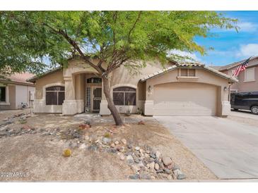 Charming single-story home with desert landscaping and a mature shade tree in the front yard at 418 E Clairidge Dr, San Tan Valley, AZ 85143