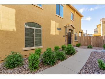 Charming two-story home featuring a landscaped yard and well-maintained exterior at 1350 S Greenfield Rd # 1040, Mesa, AZ 85206