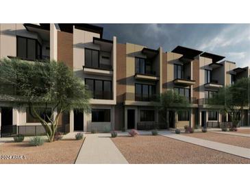 Modern townhome exterior showcasing a sleek design with contemporary finishes and drought-tolerant landscaping at 4220 N 32Nd St # 2, Phoenix, AZ 85018