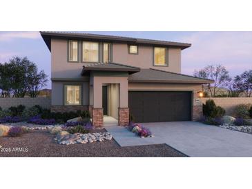 Charming two-story home with a two-car garage, beautiful desert landscaping, and a welcoming entrance at 25147 N 156Th Ln, Surprise, AZ 85387