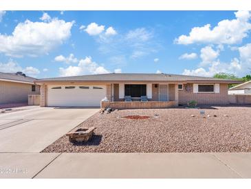 Charming single-story home with a well-maintained yard and inviting curb appeal, showcasing Arizona desert landscaping at 6237 E Boston St, Mesa, AZ 85205
