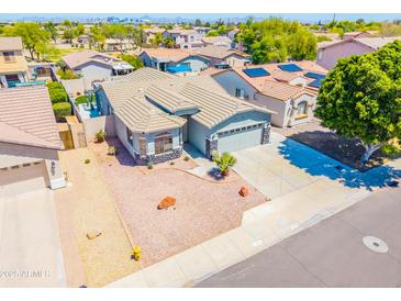 Charming single-story home with well-maintained landscape and a two-car garage in a Gathering-friendly neighborhood at 1550 W Saint Kateri Dr, Phoenix, AZ 85041