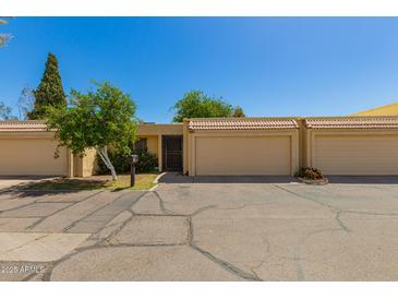 Charming single-story home featuring a private entrance, single car garage, and well-maintained landscaping at 6207 N 21St Dr, Phoenix, AZ 85015