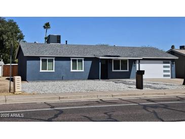Charming single-story home boasts a modern design, complemented by a well-maintained yard at 13629 N 36Th St, Phoenix, AZ 85032