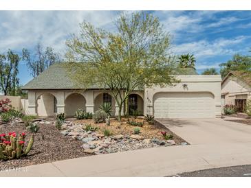 Charming single-story home with desert landscaping and a two-car garage in a quiet neighborhood at 620 N Entrada St, Chandler, AZ 85226