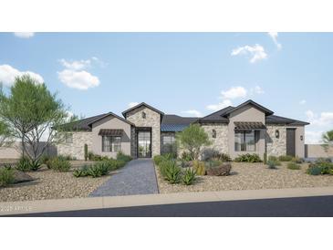 Charming single-story home featuring stone accents, a tiled roof, desert landscaping, and a welcoming entrance at 11140 W Prospector Dr, Queen Creek, AZ 85144