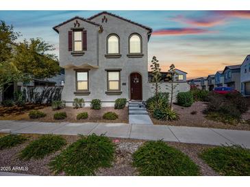Charming two-story home featuring desert landscaping and a welcoming front entrance at 20812 W Legend Trl, Buckeye, AZ 85396