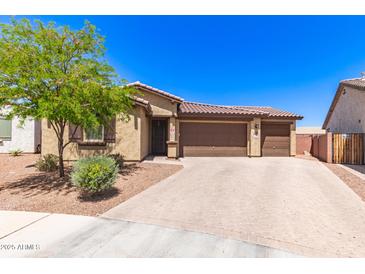 Charming single-story home featuring a three-car garage and tile roof, complemented by low-maintenance desert landscaping at 8418 W Palmaire Ave, Glendale, AZ 85305