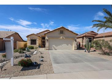 Inviting single-story home with a well-maintained desert landscape and a two-car garage at 10832 W Piute Ave, Peoria, AZ 85373