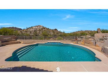 Sparkling pool features pristine blue water and offers stunning views of the surrounding desert landscape at 11856 E Parkview Ln, Scottsdale, AZ 85255
