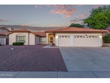 Charming single-story home with a well-maintained landscape and a spacious two-car garage at 13629 N 71St Dr, Peoria, AZ 85381