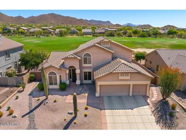 Charming two-story home featuring a three-car garage, desert landscaping, and picturesque mountain views at 3601 N Sonoran Hts, Mesa, AZ 85207