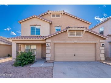Inviting two-story home featuring a large two-car garage and a well-maintained front yard at 30944 N Bramwell Ave, San Tan Valley, AZ 85143