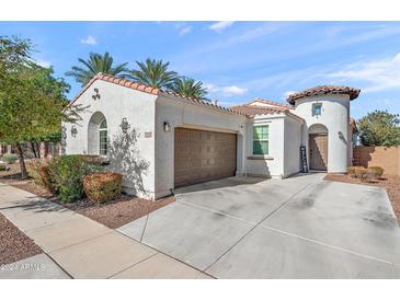 Charming single-Gathering home with a two-car garage, desert landscaping, and a welcoming front entrance at 7936 S 7Th Way, Phoenix, AZ 85042